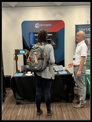 Tim talking to a conference attendee at the dymaptic booth at the GIS In Action conference